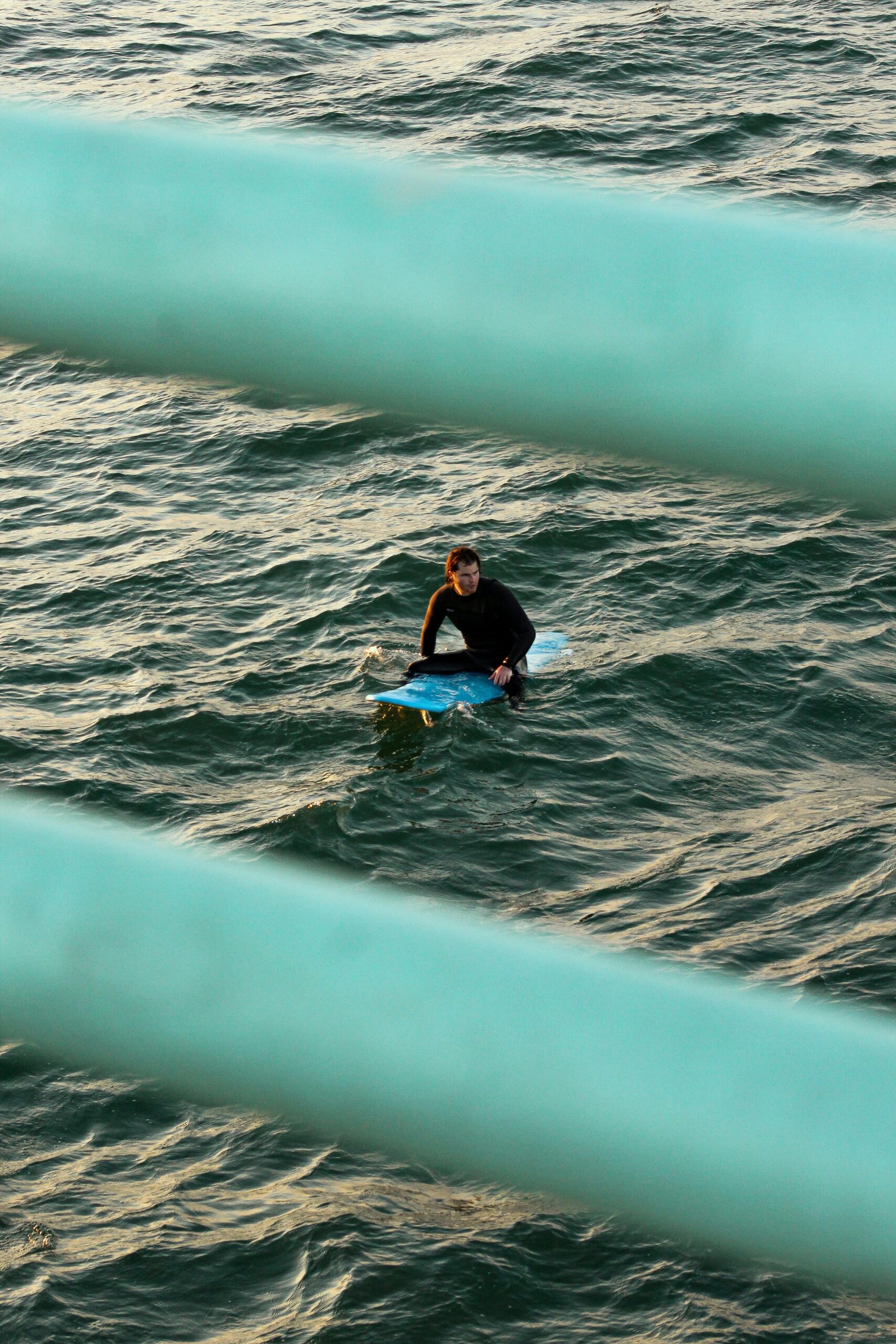 Image of a person on a blue raft in water, partially visible.